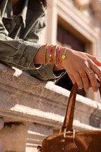 Ciao gevlochten armband met roze en oranje kralen